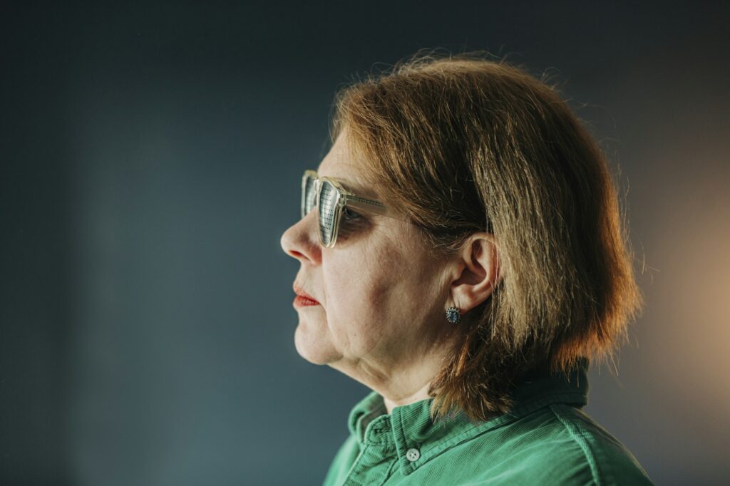 elderly woman wearing special glasses for eye training